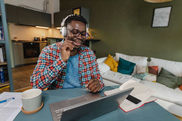 istock African-American man working in home office 1383987179