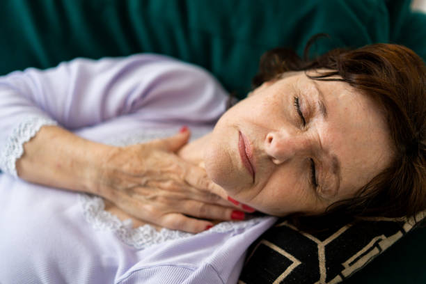 istock Sick woman lying on the sofa 1383987215