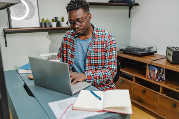istock African-American man working in home office 1383988735