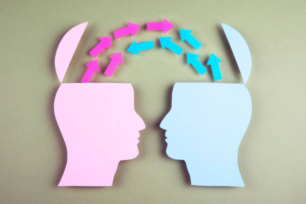 istock Human heads in paper cut style and arrows 1383991603