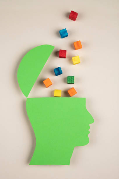 istock Human head in paper cut style with multicolored cubes 1383991646