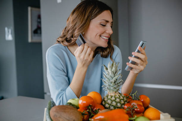 istock Ordering groceries online and paying contactless 1383994241