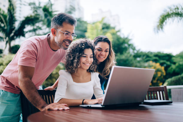 istock Family using laptop at resting area 1383996227