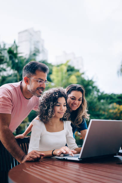 istock Family using laptop at resting area 1383996228