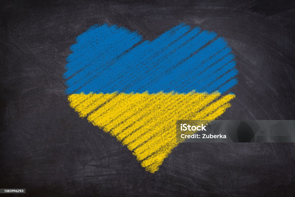 Chalk Heart Sign in Ukrainian Flag Colors Heart shape chalk drawing on blackboard in Ukrainian Flag colors: blue and yellow. Ukraine Stock Photo