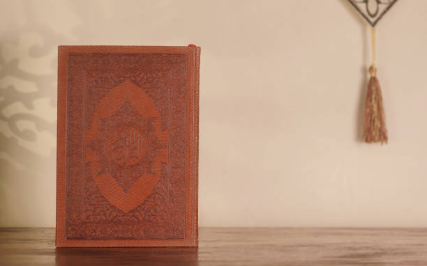 istock The  Quran on a wooden table with a copy space for design or texts , Ramadan Kareem 1384000245