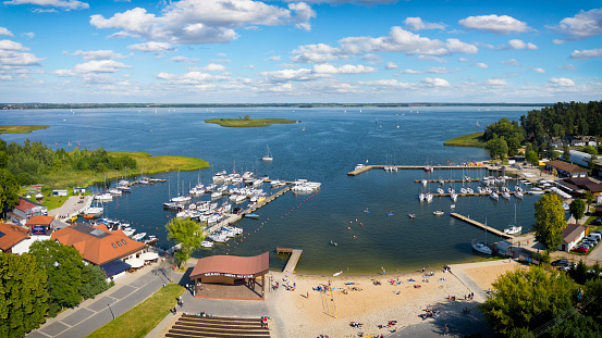 Holidays in Poland - aerial view of beach with a marina in Wilkasy at the Niegocin lake in Masuria, land of a thousand lakes