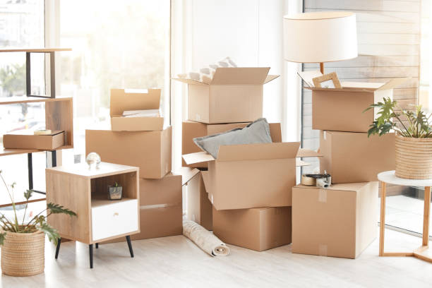 istock Shot of cardboard boxes stacked in a room while moving house 1384018262