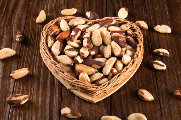 istock Brazil nuts on wooden background 1384028827