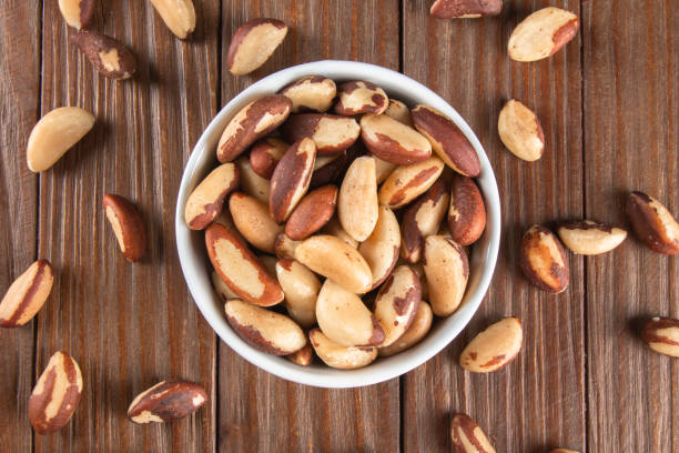 istock Brazil nuts on wooden background 1384028842