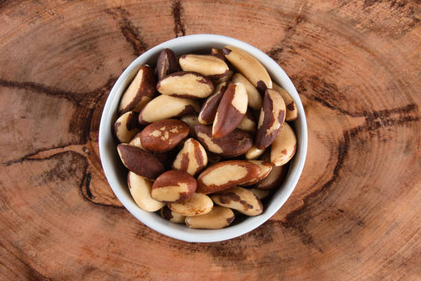 istock Brazil nuts on wooden background 1384028855