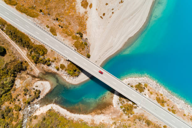 istock Aerial view of car on small bridge. 1384032698