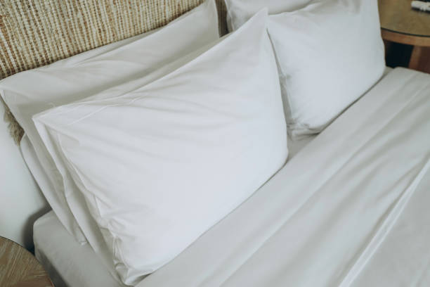 istock White comfortable pillow on bed in hotel bedroom 1384052240