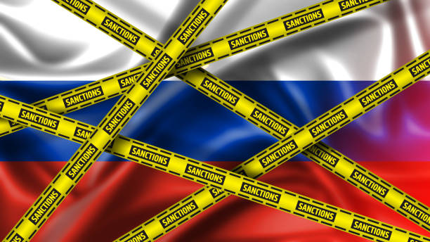Russia Sanctions Concept. Yellow Tape with Sanctions Sign Against of Russia. stock photo