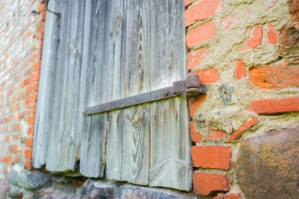 istock old wooden door on a brick wall 1384054855