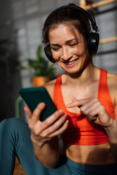 istock Cute girl using smartphone 1384057416