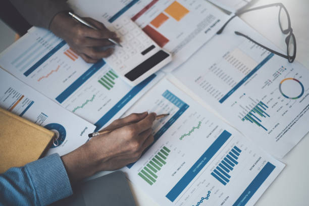 istock Group of Business people and Accountant checking data document on digital tablet for investigation of corruption account . Anti Bribery concept. 1384073432