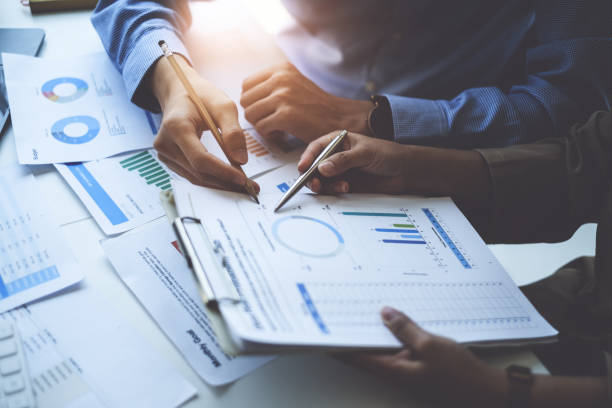 istock Group of Business people and Accountant checking data document on digital tablet for investigation of corruption account . Anti Bribery concept. 1384073434