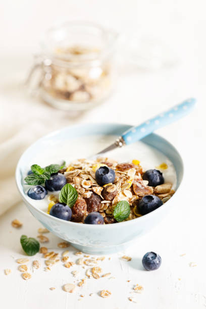 istock Healthy breakfast with yogurt, granola and fresh blueberries. 1384097467