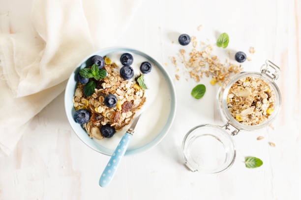 istock Healthy breakfast with yogurt, granola and fresh blueberries. 1384097725