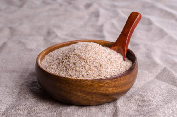 istock Brown psyllium in a wooden bowl 1384103755