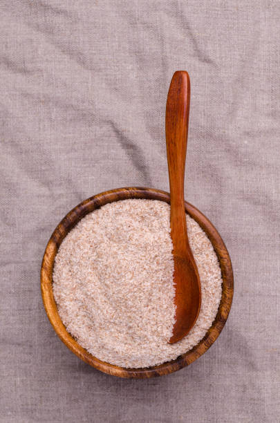 istock Brown psyllium in a wooden bowl 1384103764