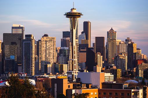 The city of Seattle Skyline with focus on Space Needle at sunset with blue sky and copy space. Shot from Kerry Park in Seattle, Washington, USA