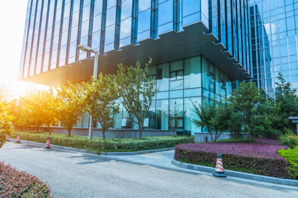 istock empty asphalt road near glass office building 1384107019
