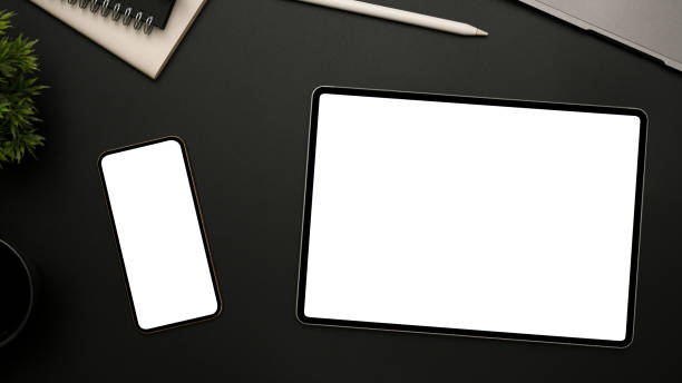 istock Minimal black office desk with portable tablet, smartphone mockup 1384108815