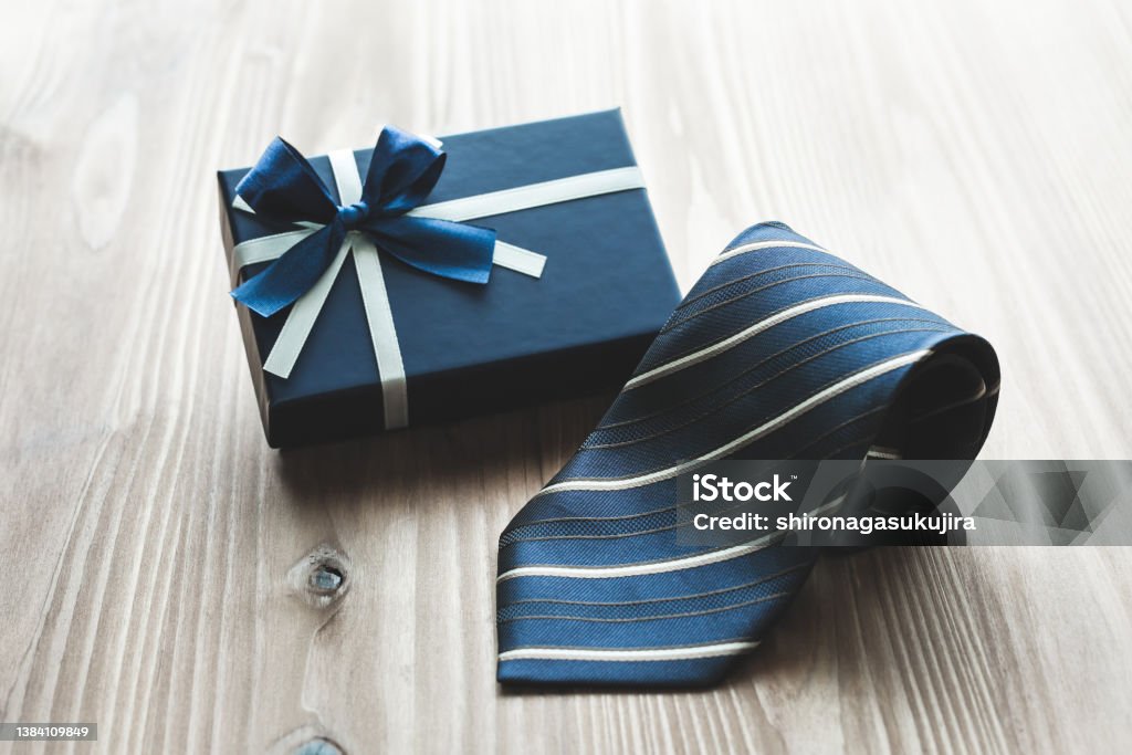 Image of a gift for Father's Day and men. Gifts, men, Father's Day, wood grain background Necktie Stock Photo