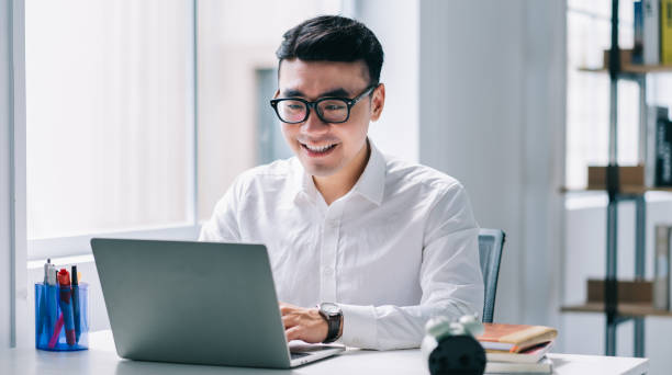 Young Asian businessman working at office
