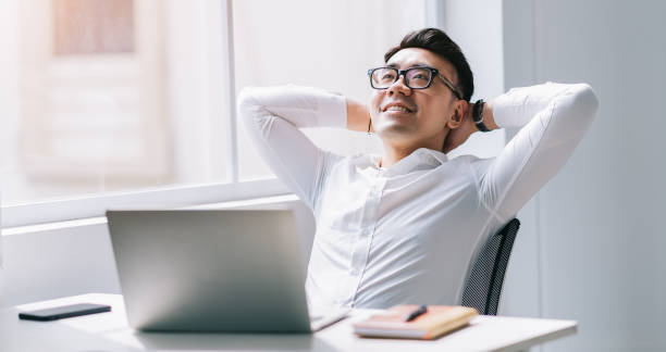 istock Young Asian businessman working at office 1384109923