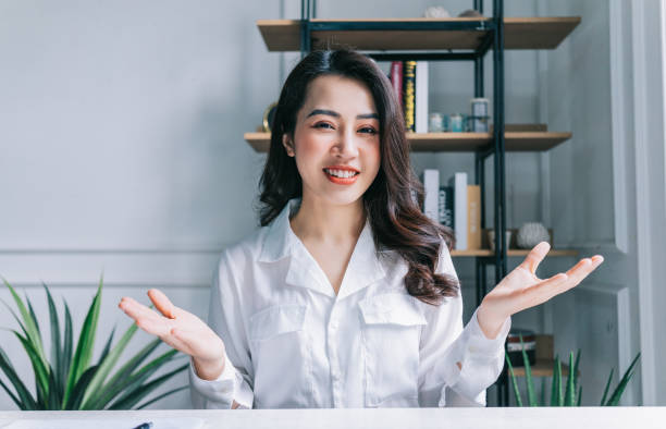 istock Young Asian businesswoman working at office 1384111031