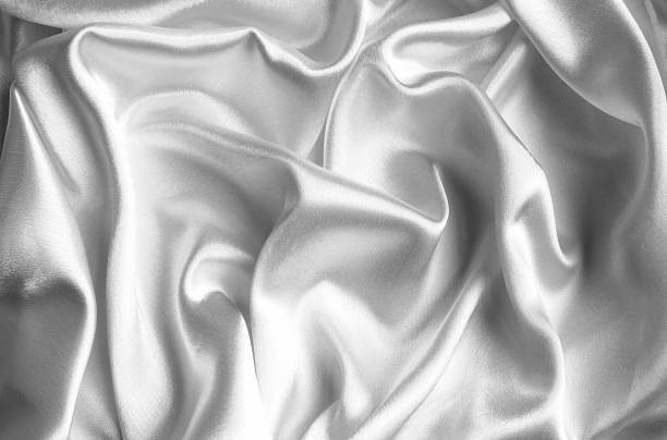 istock Satin fabric fabric white color background texture. 1384117508