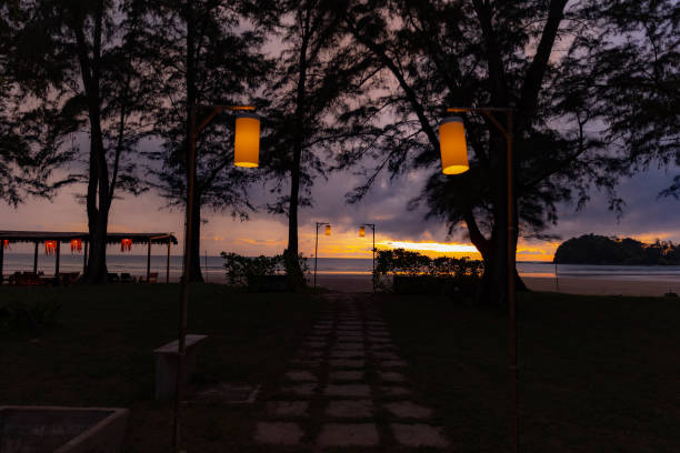 istock sunset on the beach in holiday 1384126322