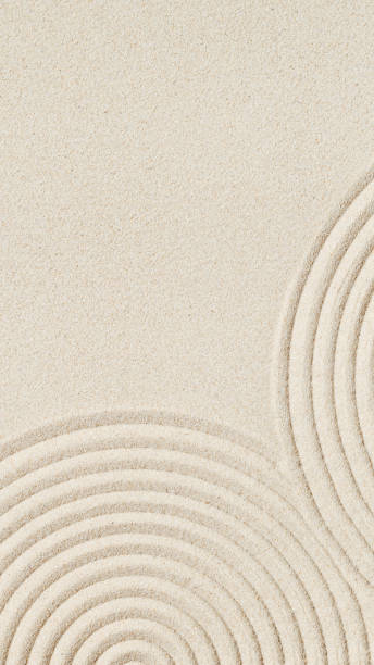 istock Pattern in Japanese Zen Garden with concentric circles on sand for meditation and tranquility 1384136524