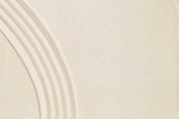 istock Pattern in Japanese Zen Garden with concentric circles on sand for meditation and tranquility 1384136529