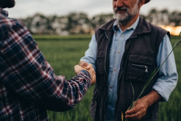 istock farmers talking on field 1384142607