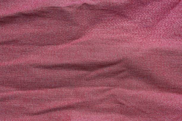 istock The wrinkled fabric is ribbed, burgundy. 1384143142