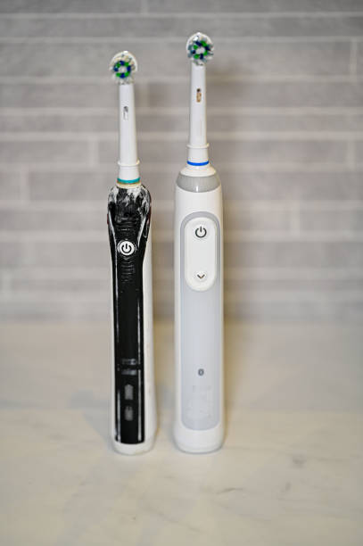 istock unclean electric toothbrush standing on bench in bathroom 1384143799