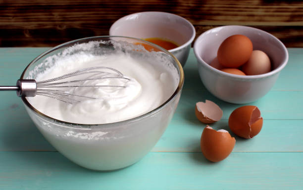 istock In a large glass bowl is a beaten egg white. 1384144827