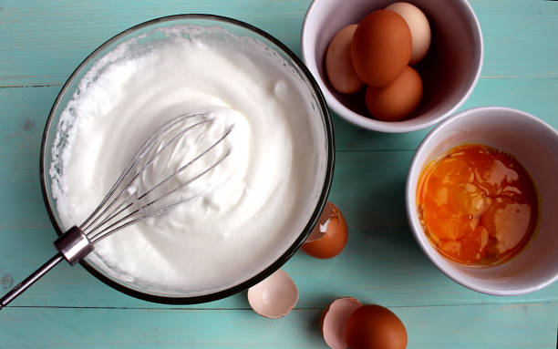 Large glass bowl with protein foam. Large glass bowl with protein foam. egg white stock pictures, royalty-free photos & images