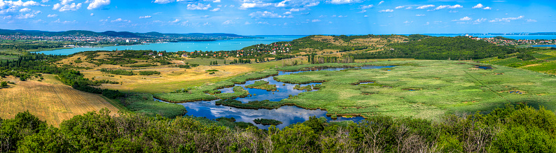 Panoramic photo of the surroundings of Lake Balaton in Hungary with marshland, fields and forests