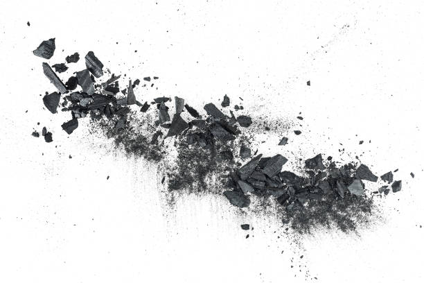 istock Black charcoal particles isolated on a white background, top view. Activated charcoal powder. Black dust powder charcoal. 1384145413