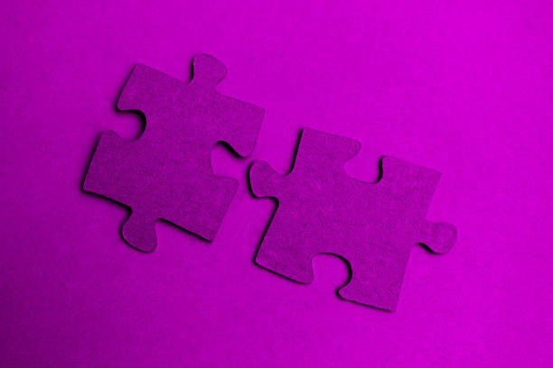 A close-up of a white jigsaw puzzle with one missing piece. The empty space creates a strong visual metaphor for problem-solving, completion, and teamwork, emphasizing the importance of every individual part in a larger whole.