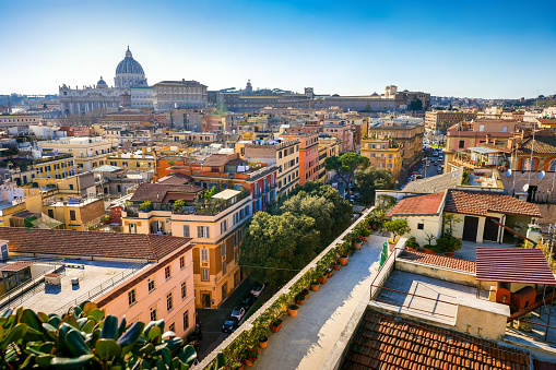 A suggestive cityscape of the heart of Rome seen from a terrace in the Prati district with St. Peter’s on the horizon