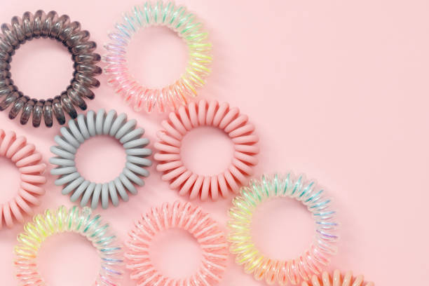 istock Spiral hair rubber bands on pink background 1384149613