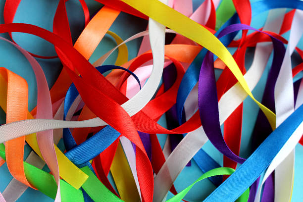 istock Satin ribbons of different colors lie on the surface. 1384149811