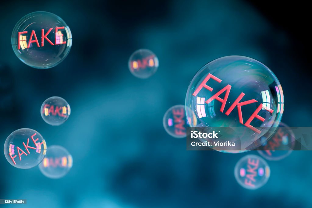 Soap bubbles with FAKE sign inside Some soap bubbles with FAKE sign inside. Blue background, space for copy. Fake News Stock Photo