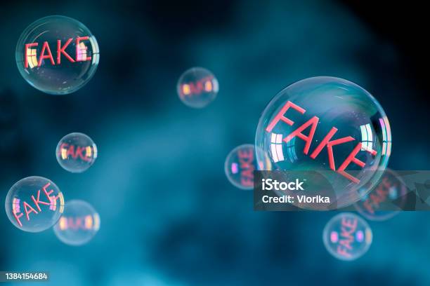 Soap Bubbles With Fake Sign Inside Stock Photo - Download Image Now - Fake News, Misinformation, Broadcasting